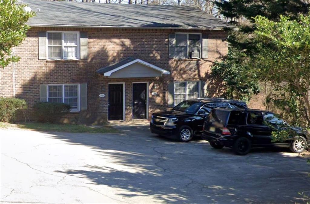 a car parked in front of a house