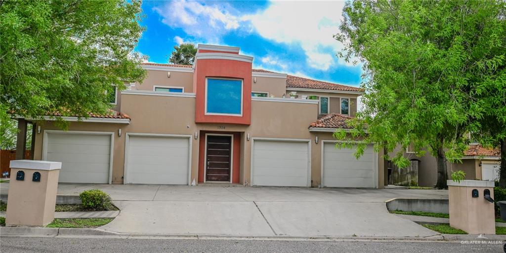 View of front facade featuring a garage