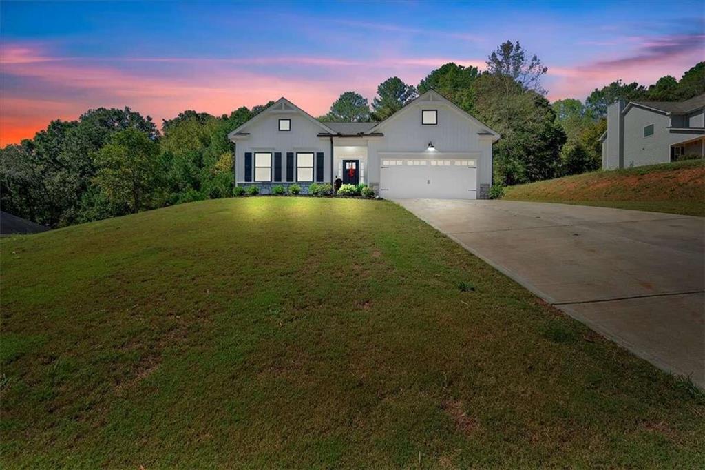 a front view of a house with a yard