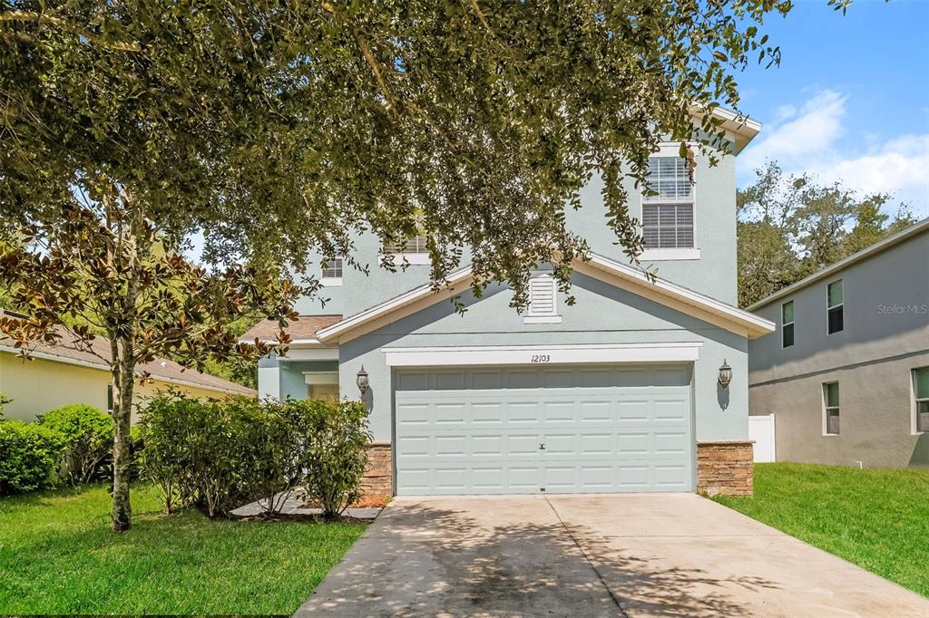 front view of a house with a yard