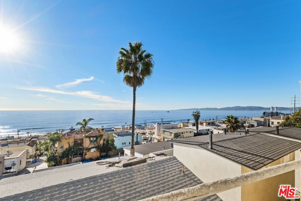 a view of a balcony with an ocean view