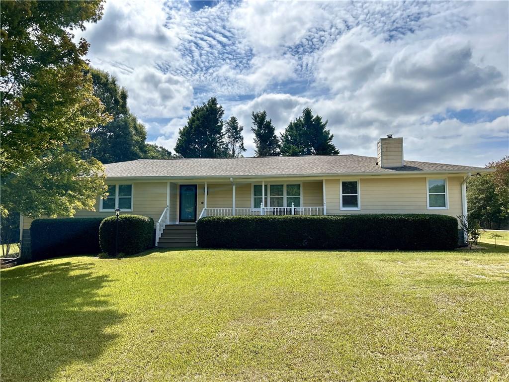 a front view of a house with a yard