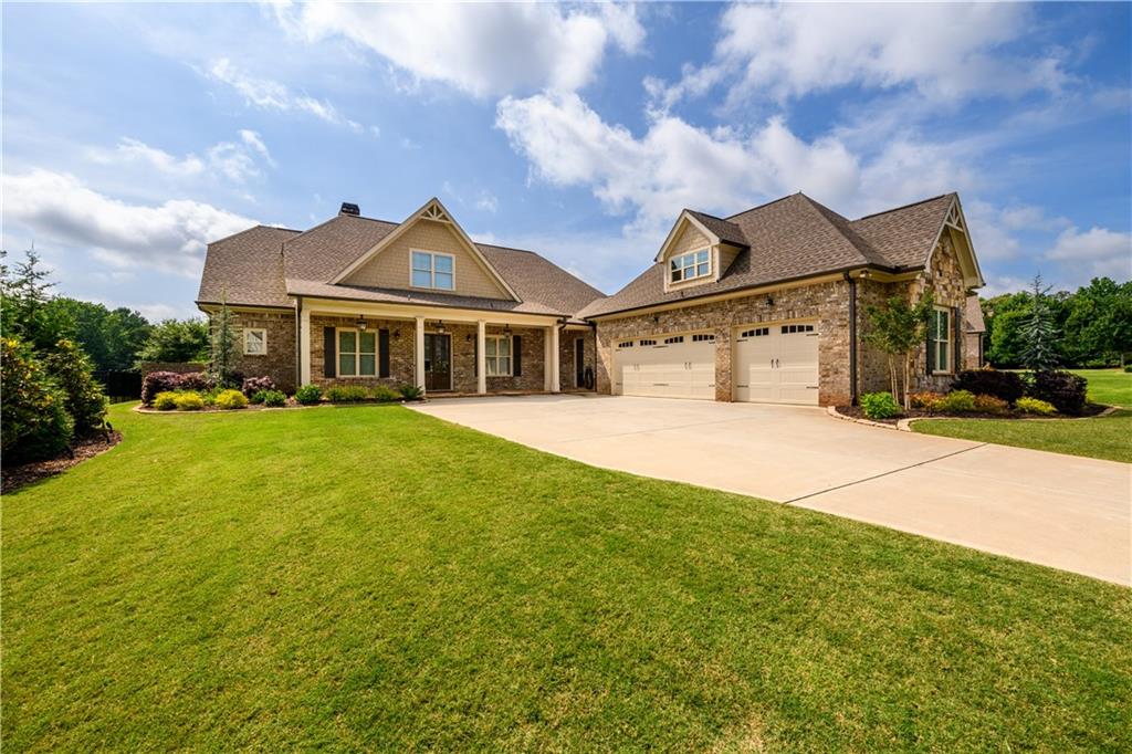 a front view of a house with a yard