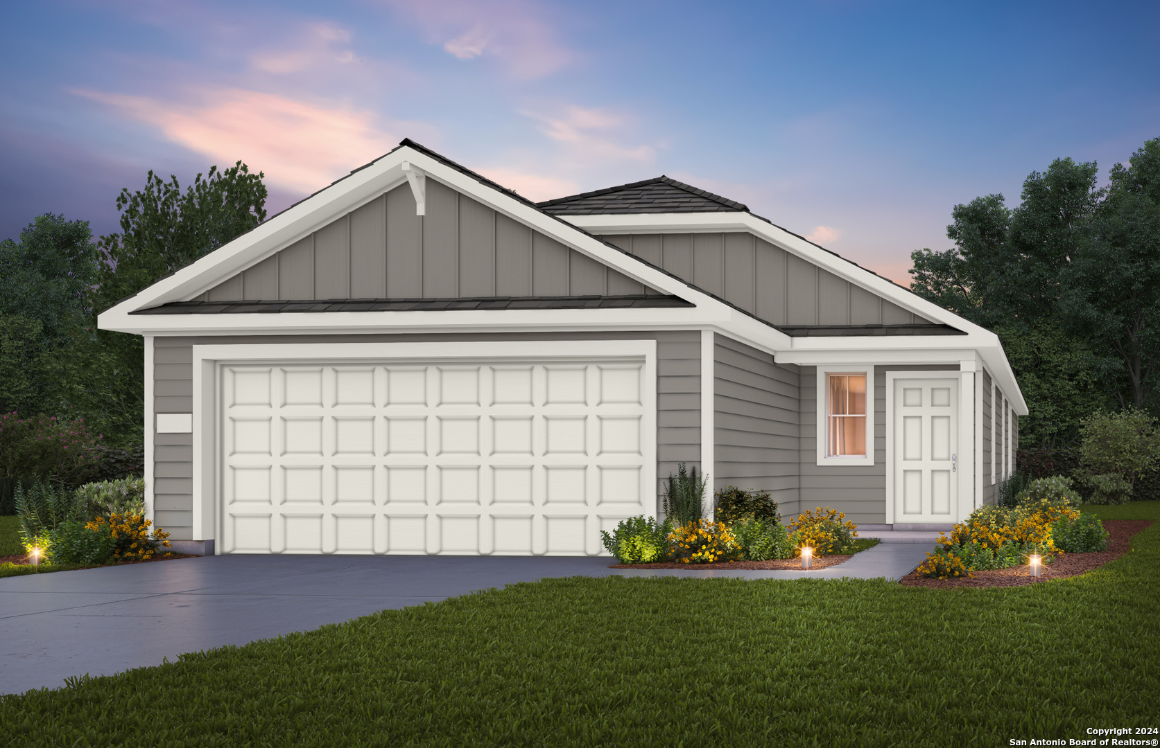 a front view of a house with a yard and garage