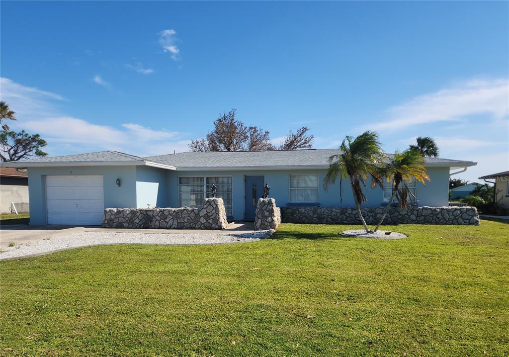 a view of a house with swimming pool and a yard