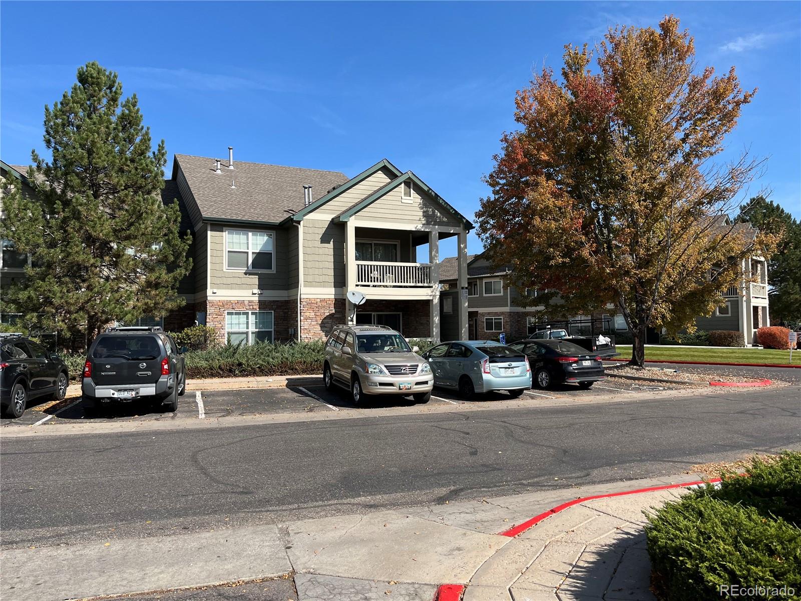 a view of a parked cars in front of a house