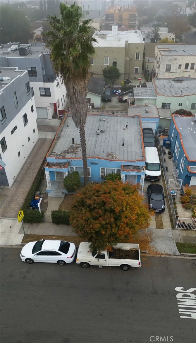 an aerial view of a house with a yard basket ball court and outdoor seating