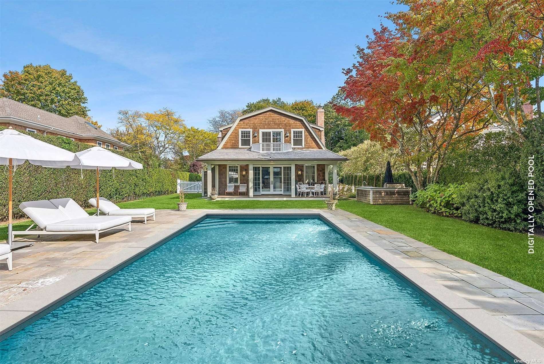 a view of swimming pool with outdoor seating and yard