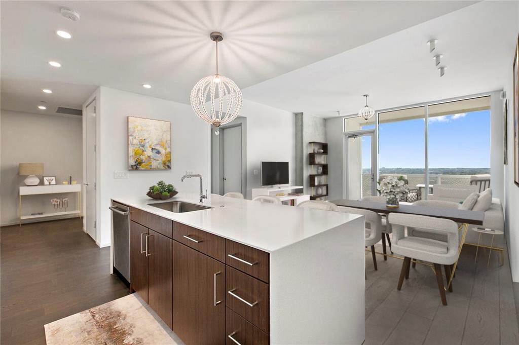 a kitchen with a sink a counter space and appliances