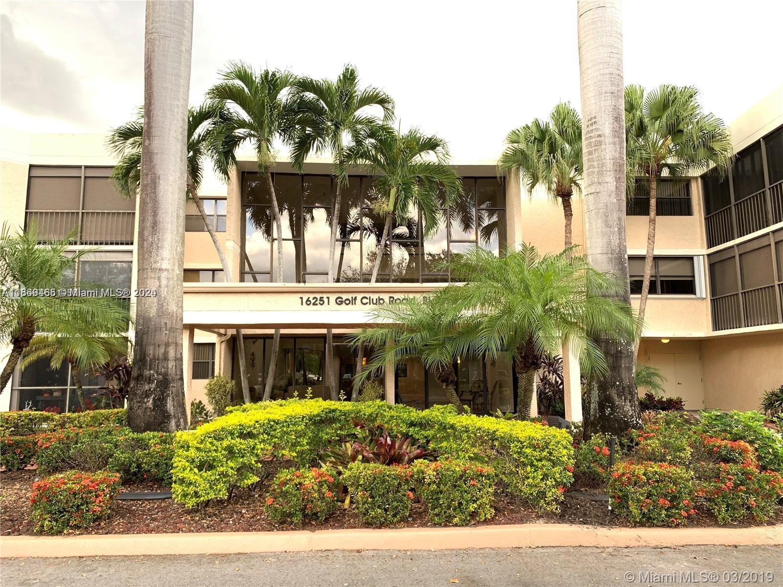 a front view of building with yard