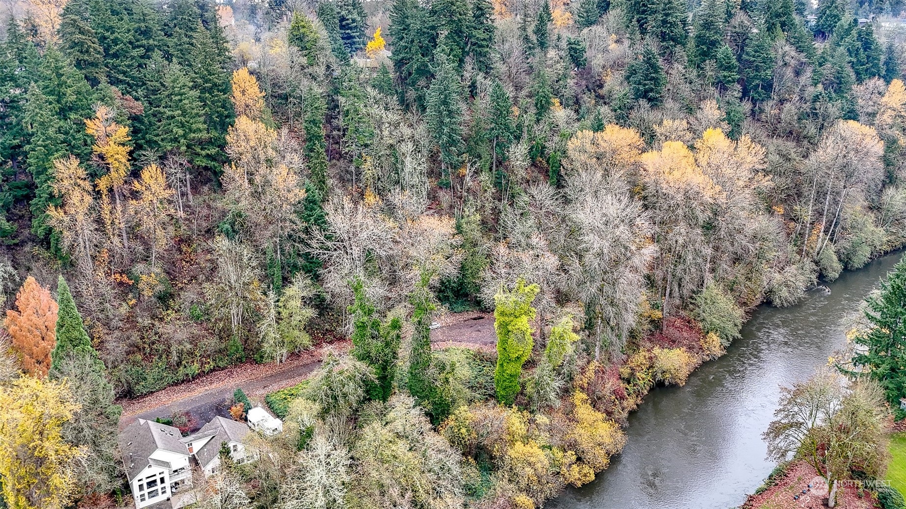 an aerial view of a houses with yard