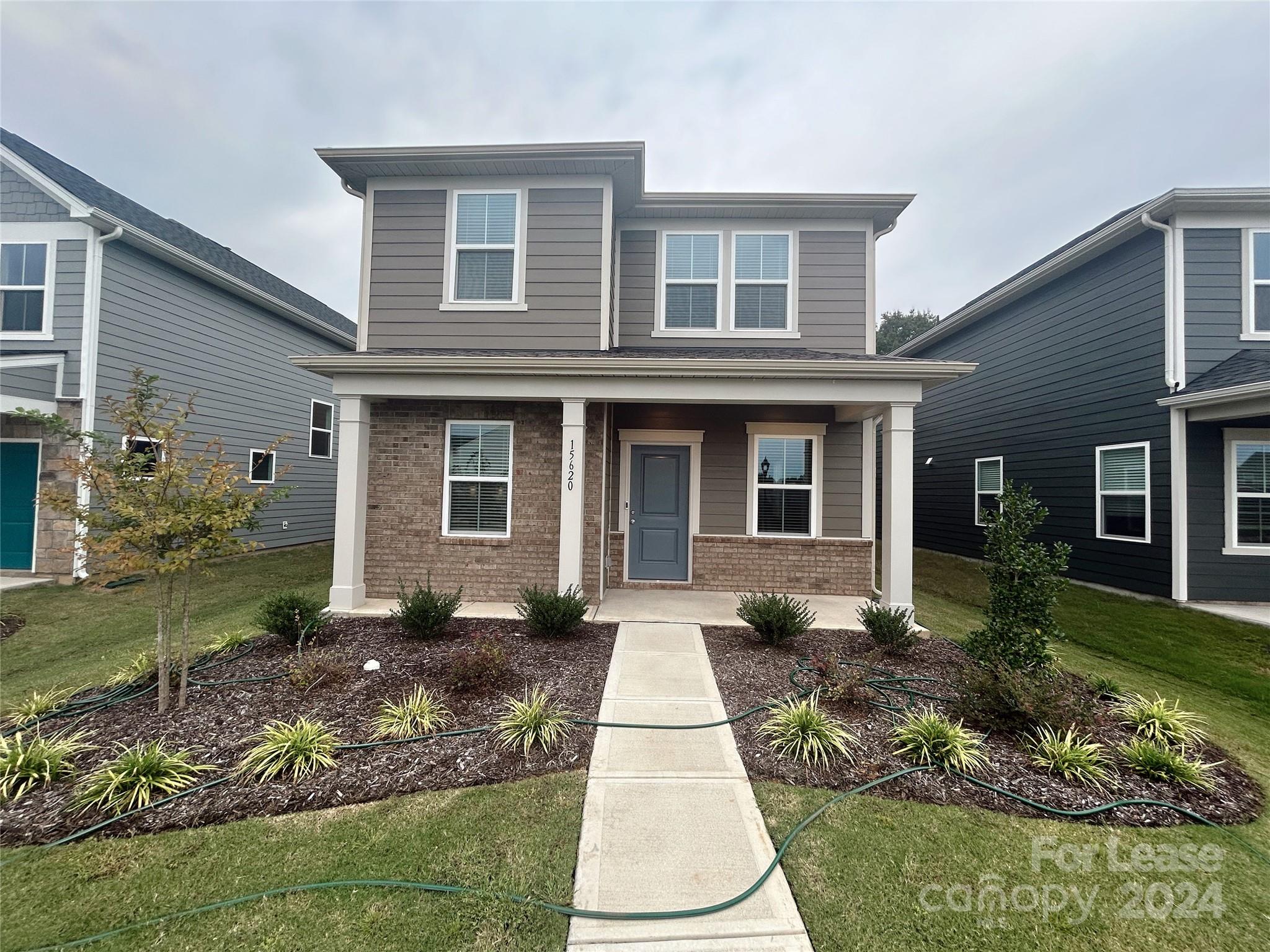 front view of a house with a yard