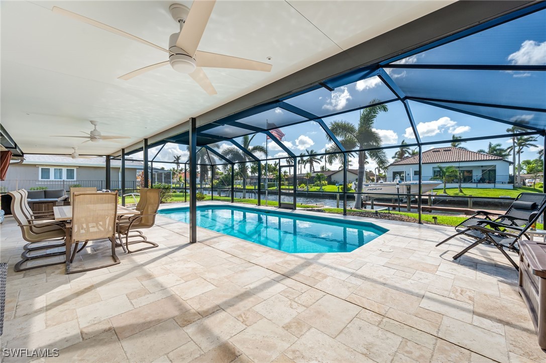 a view of a swimming pool with a patio