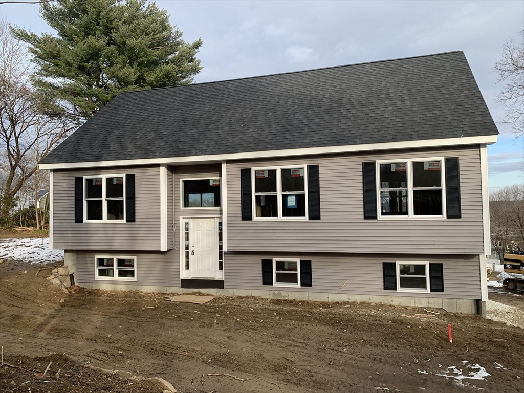 a front view of a house with garage