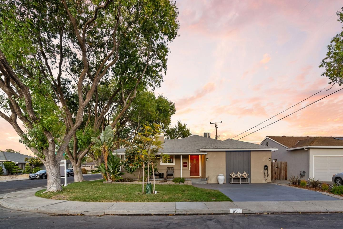 a front view of a house with a garden