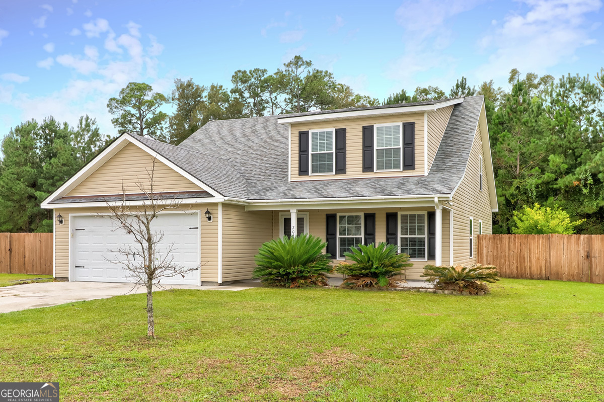 a view of a house with a yard