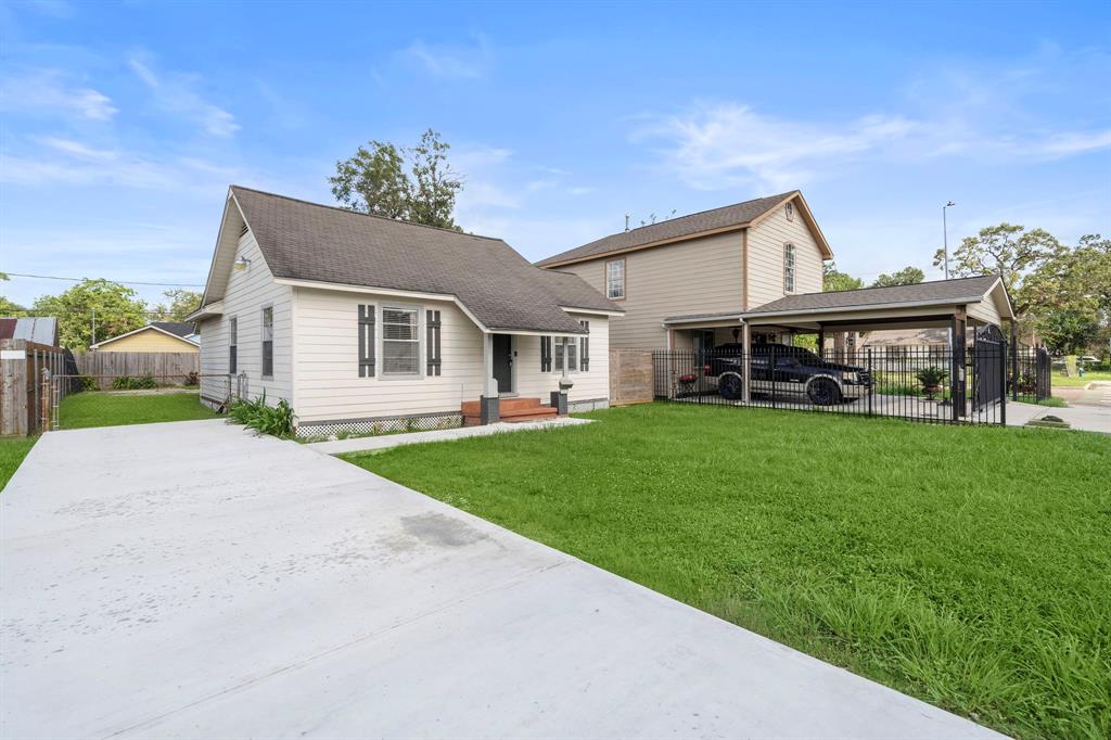 a front view of house with yard outdoor seating and green space