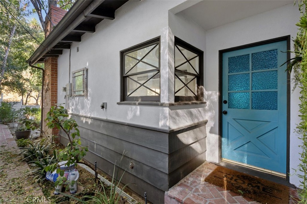 a view of house with shower and wooden floor