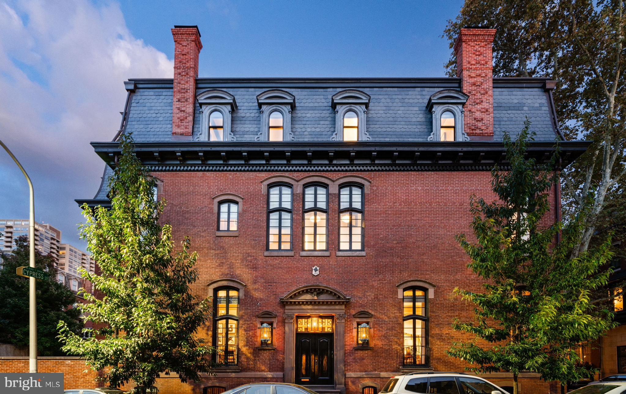 a front view of a house with large windows