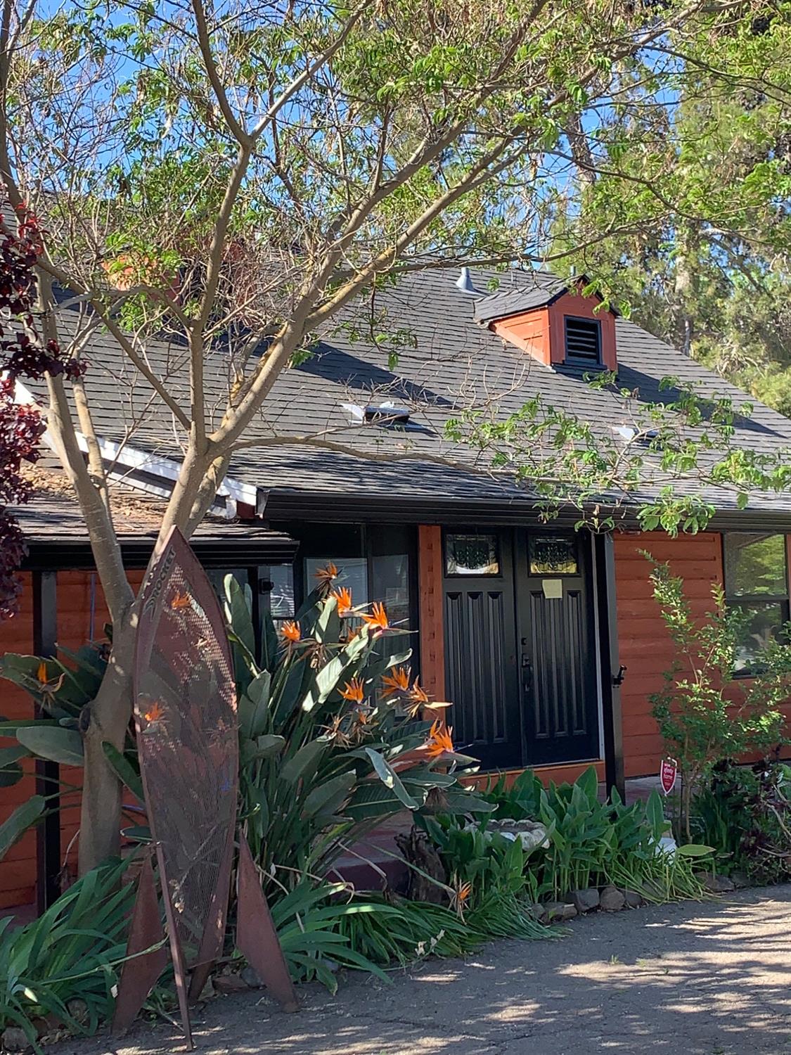 a front view of a house with garden