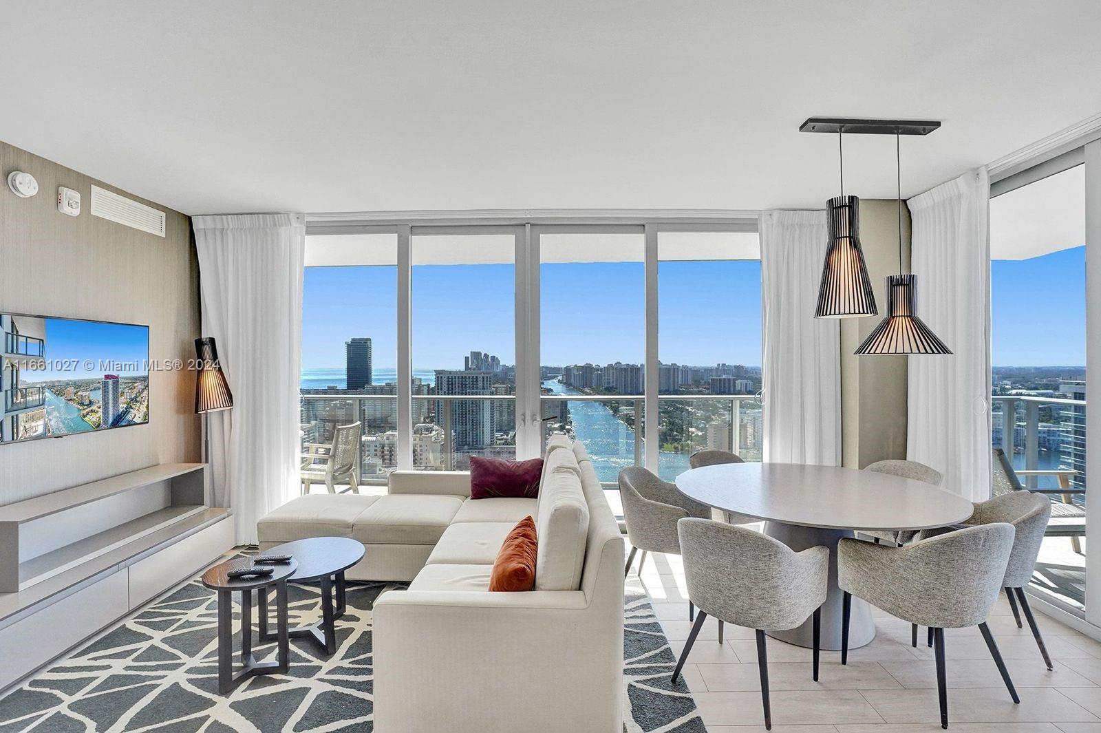 a view of a dining room with furniture window and outside view