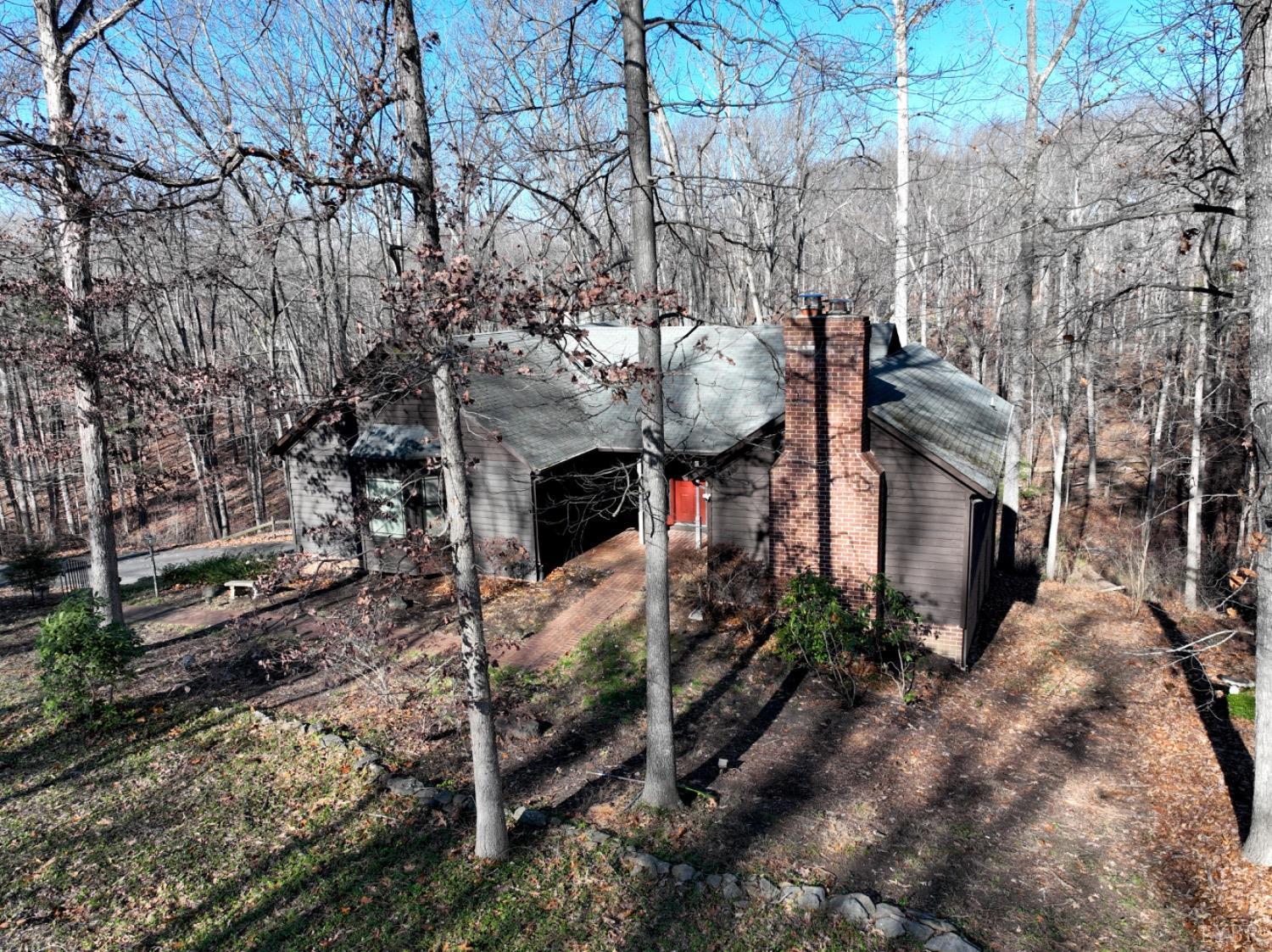 a view of a house with a tree beside it