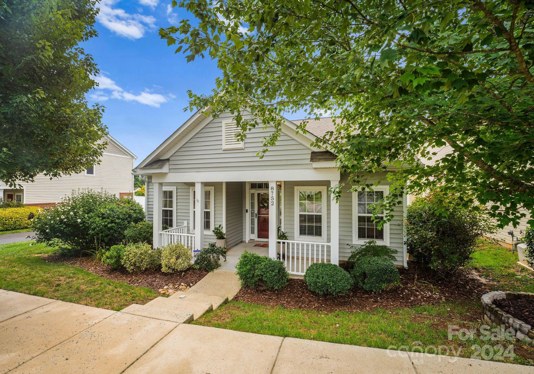 front view of a house with a garden