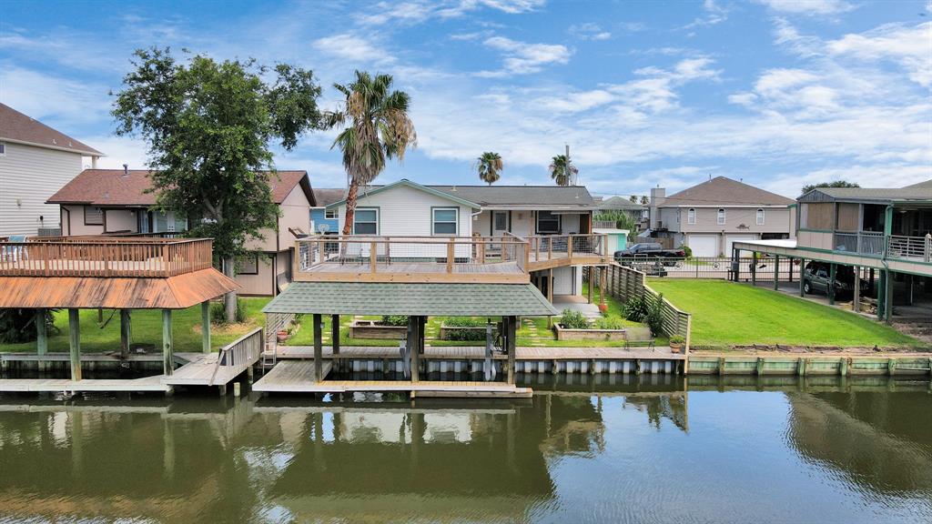 a view of a lake with a house swimming pool and outdoor space