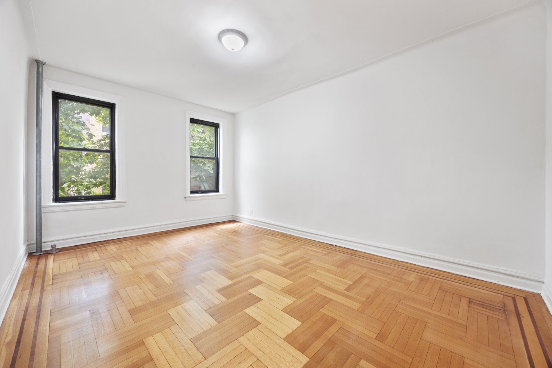 a view of an empty room and window