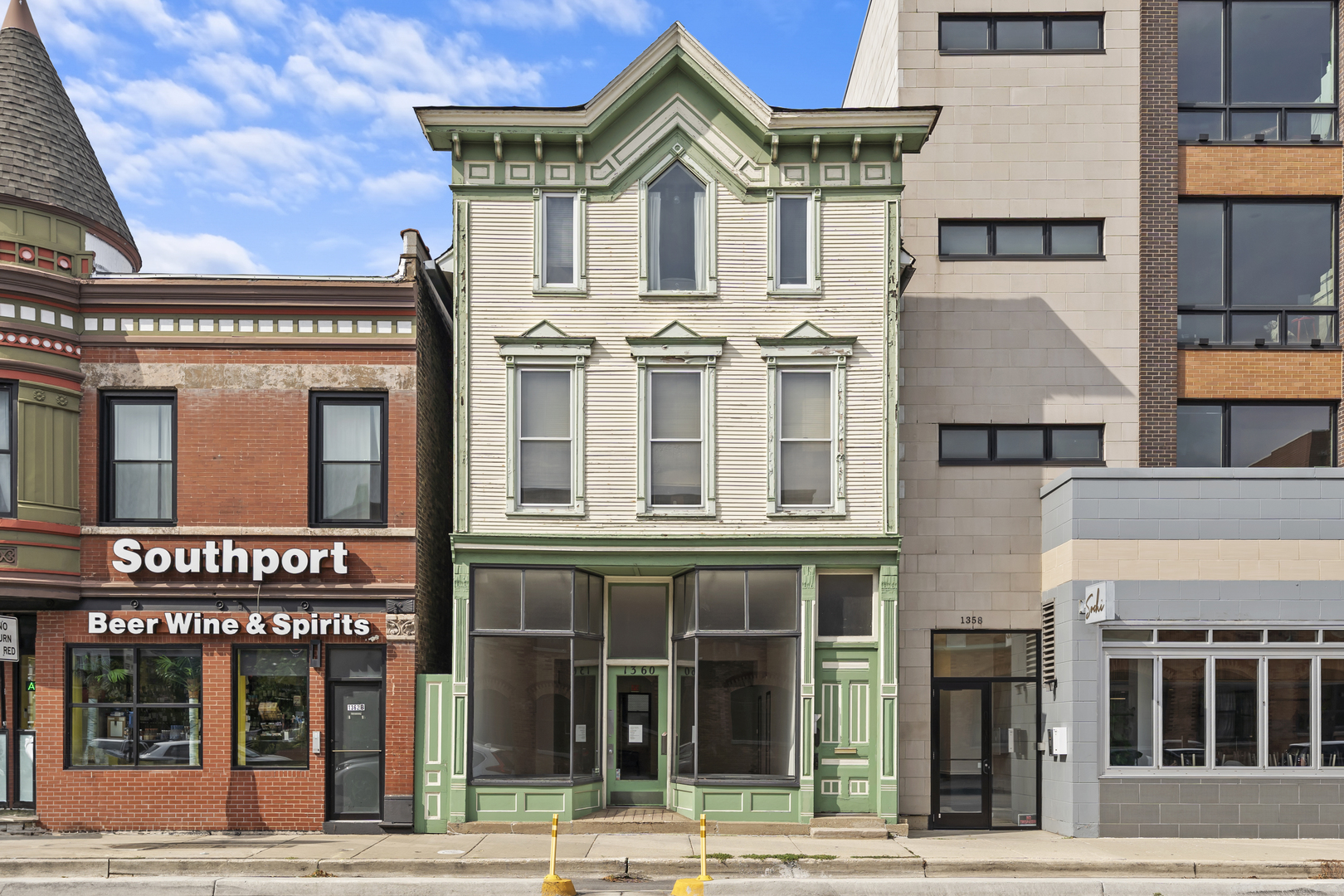 a view of a building with a street