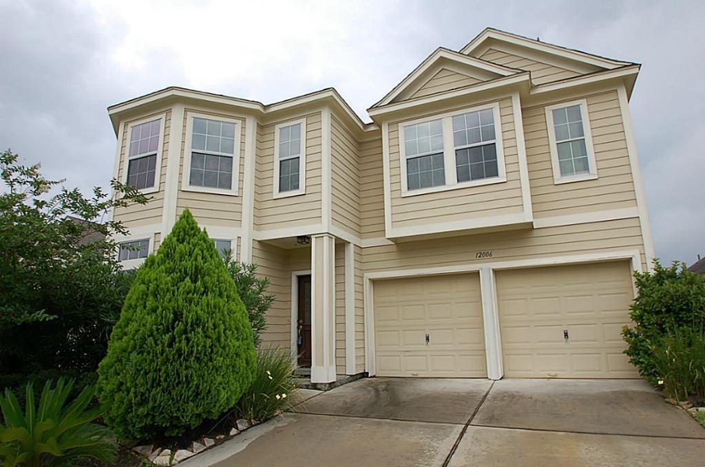 a front view of a house with a garage