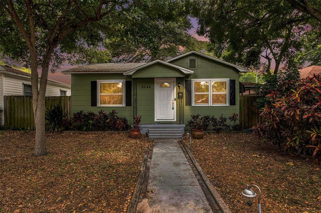 a front view of a house with yard