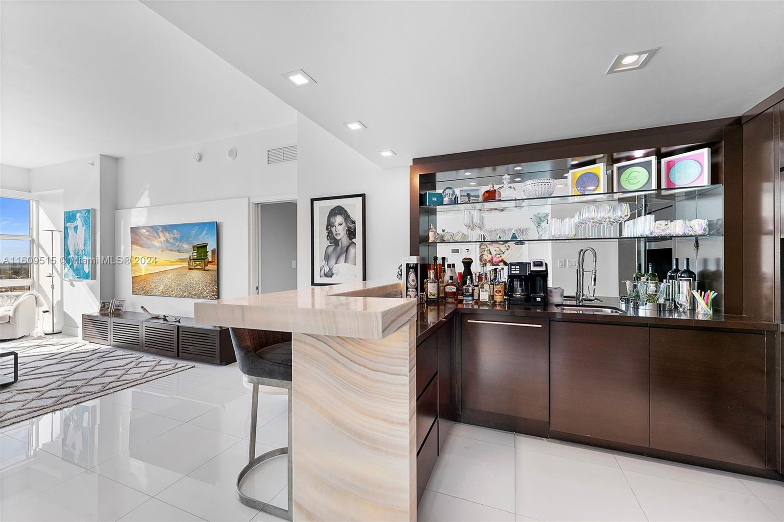 a kitchen with a large counter top space and stainless steel appliances