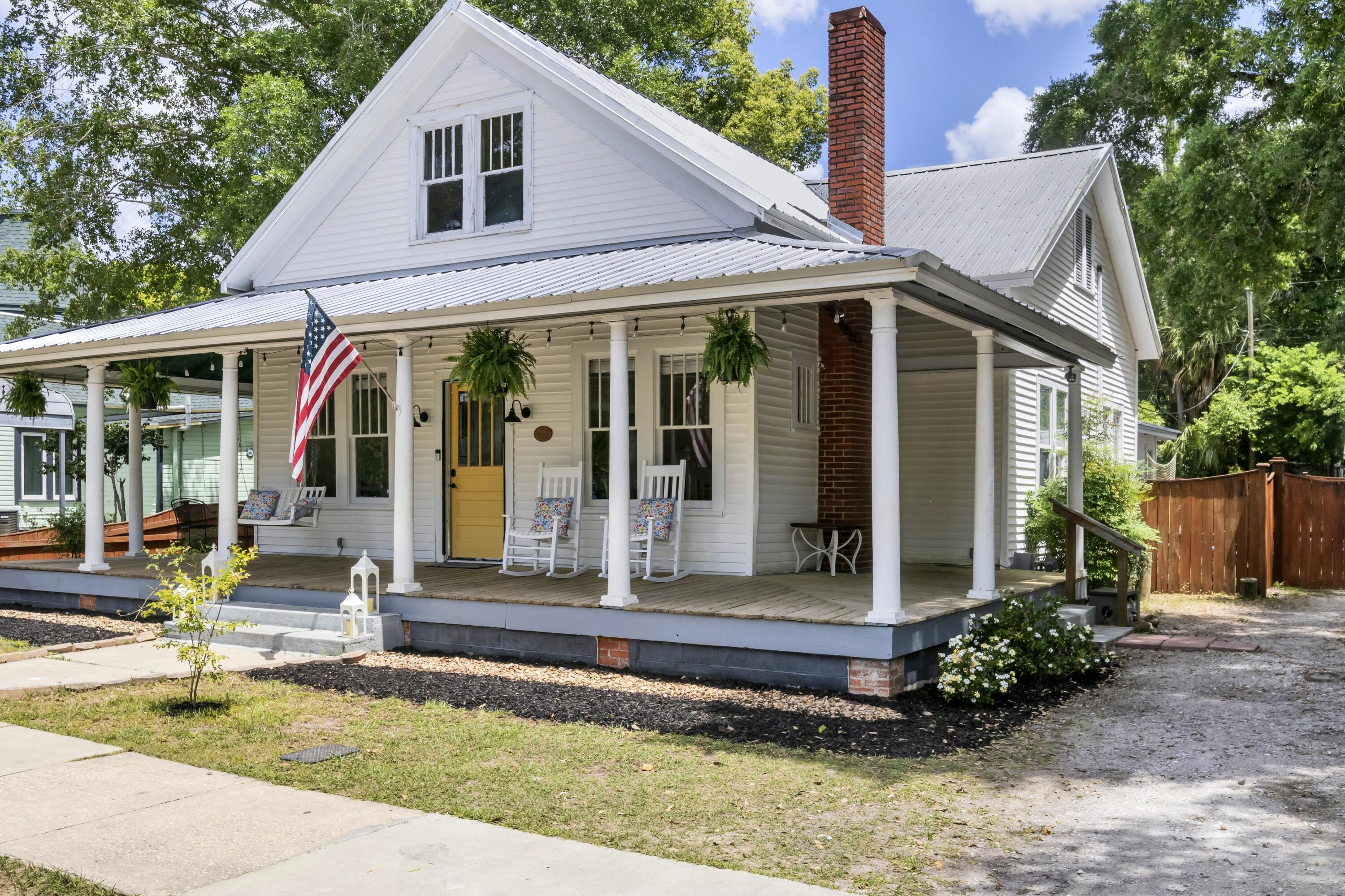 a front view of a house with garden