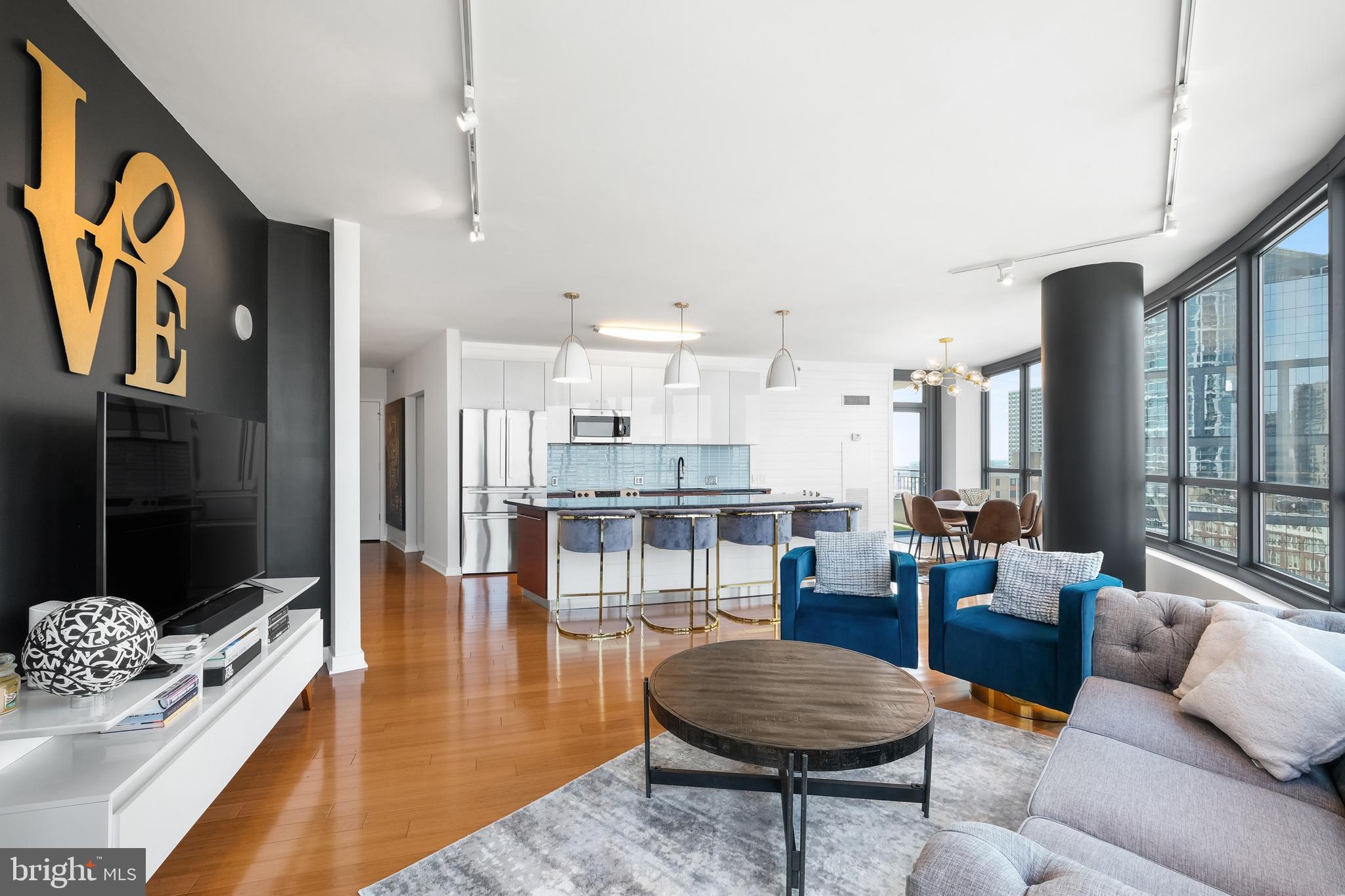 a living room with furniture and a table