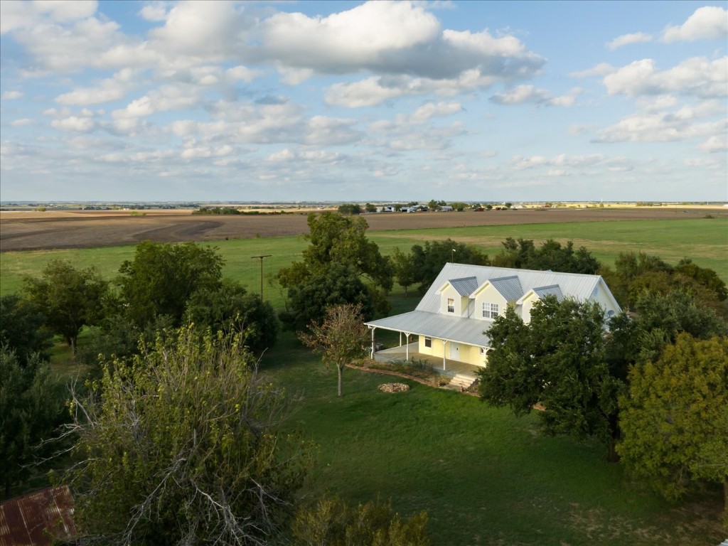 a view of a lake with a yard