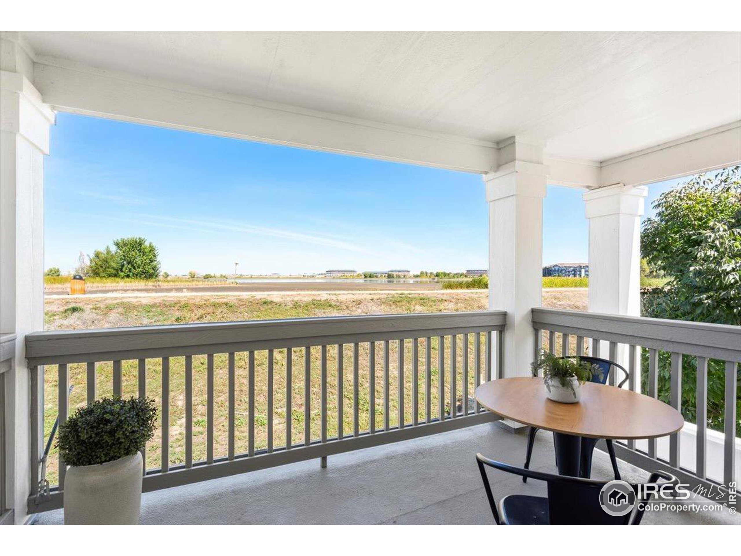 a view of a balcony with furniture