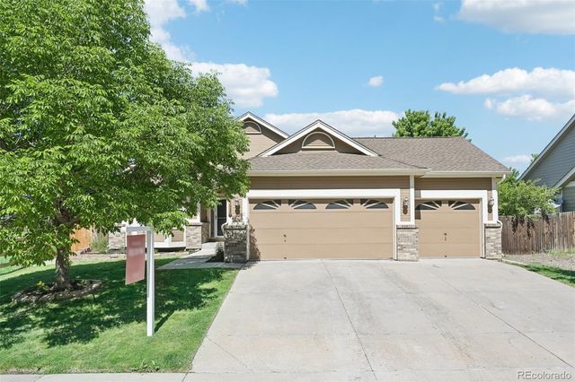 $615,000 | 5879 South Versailles Street | Saddle Rock Ridge