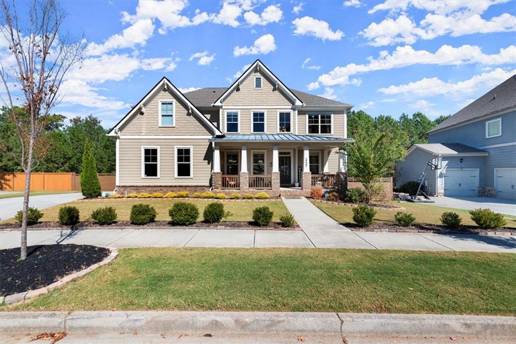 a front view of a house with a yard