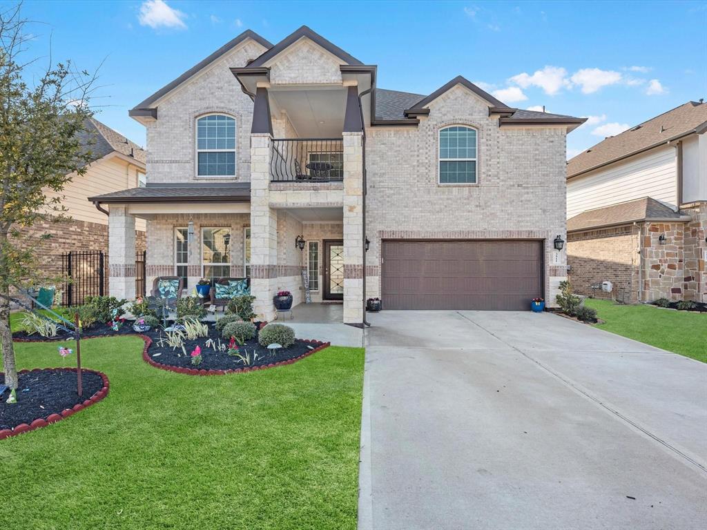 a front view of house with yard and outdoor seating