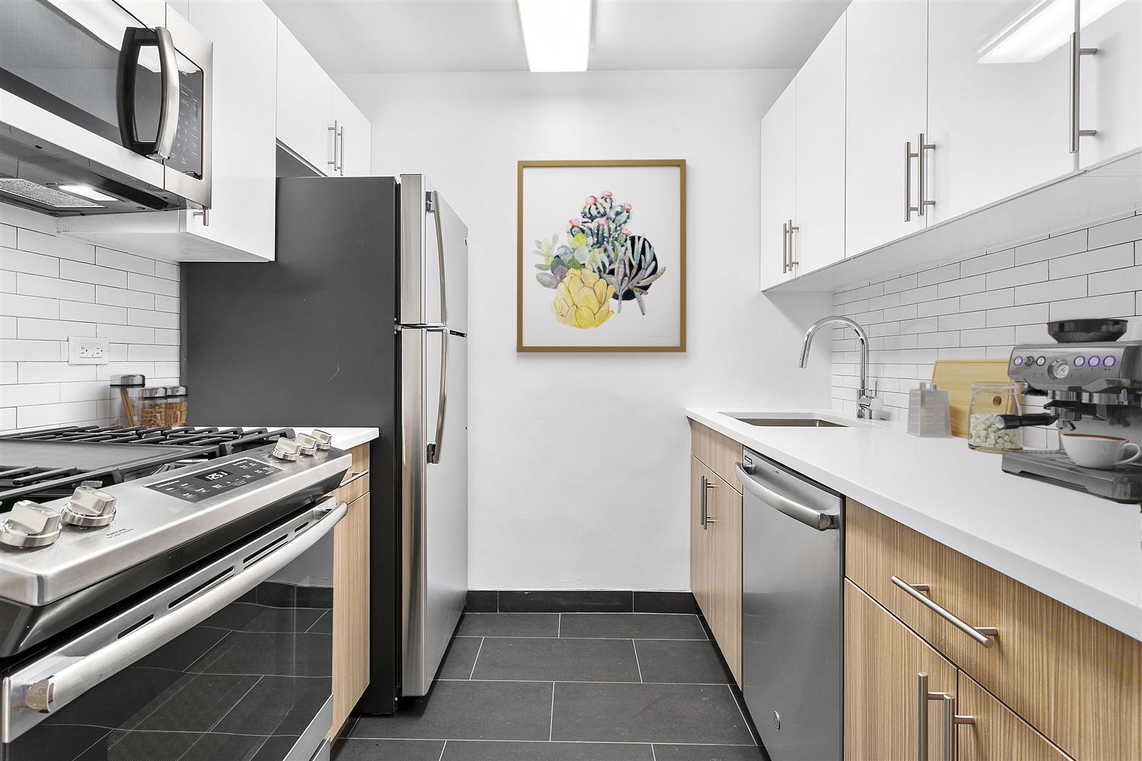 a kitchen with stainless steel appliances a stove and a refrigerator