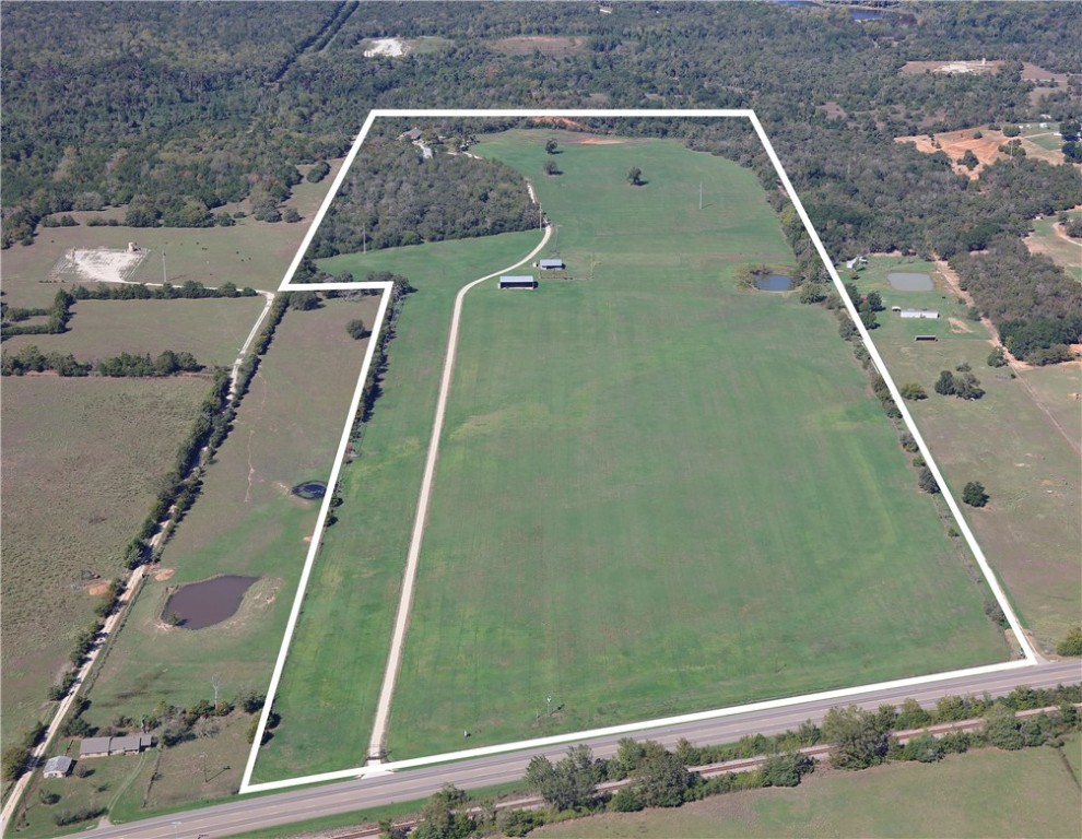 Birds eye view of property with a rural view