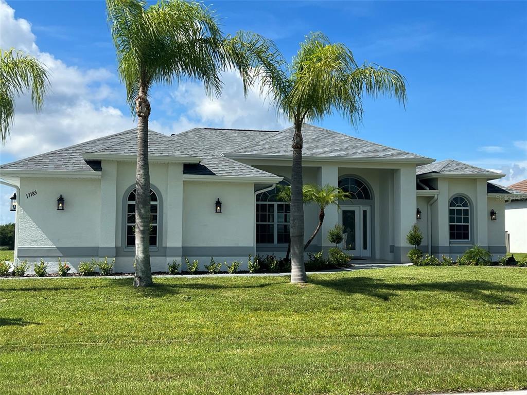 a front view of a house with garden