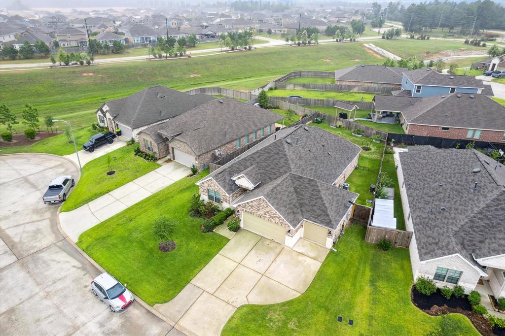 Welcome to this beautiful home in Magnolia Ridge Forest subdivision located in Magnolia, TX and zoned to Magnolia ISD. This home is unique in that it offers you a 3-car garage WITH an additional 4 foot extension. That is plenty of space for your vehicles and other garage storage needs.