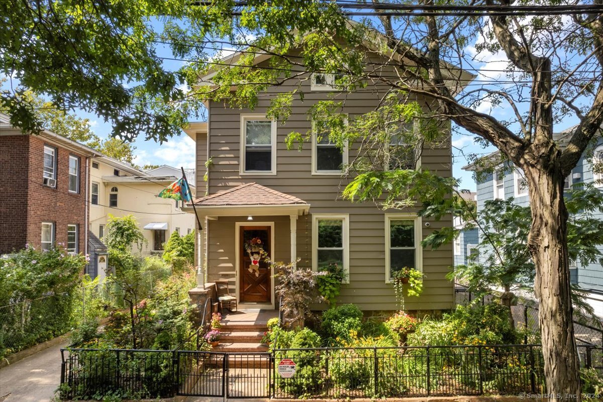 front view of a house with a garden