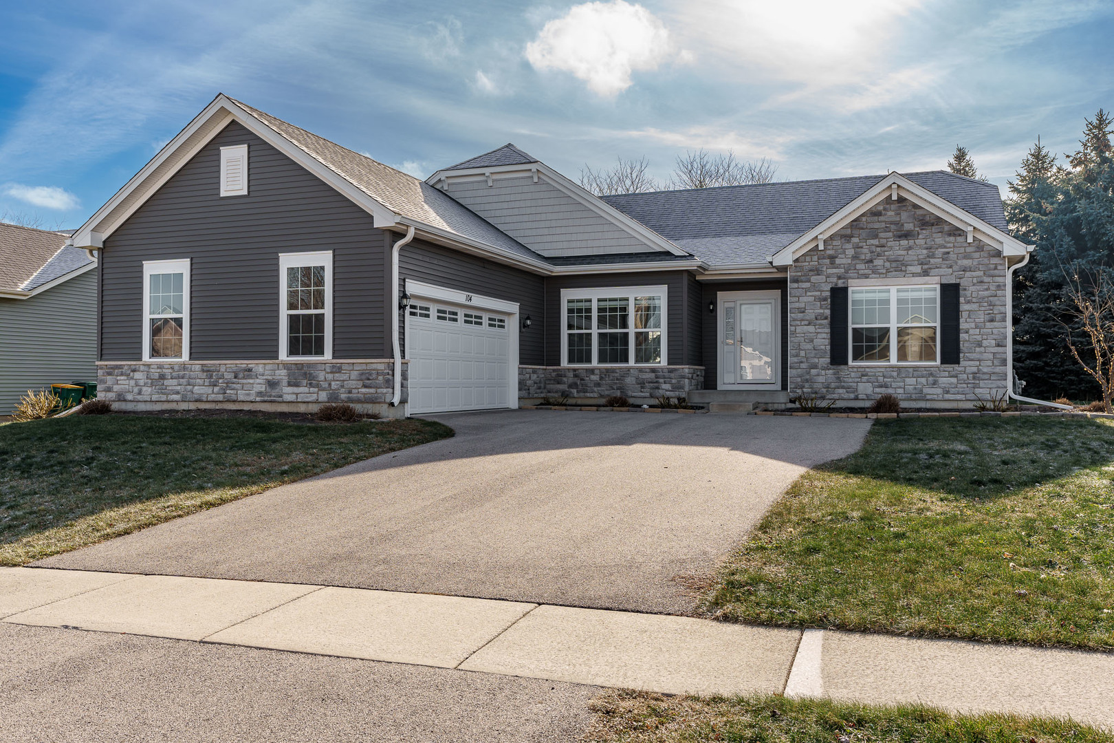 front view of a house with a yard