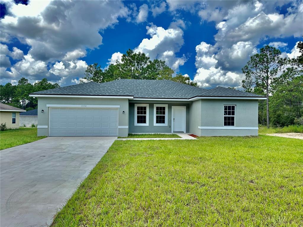 front view of a house with a yard