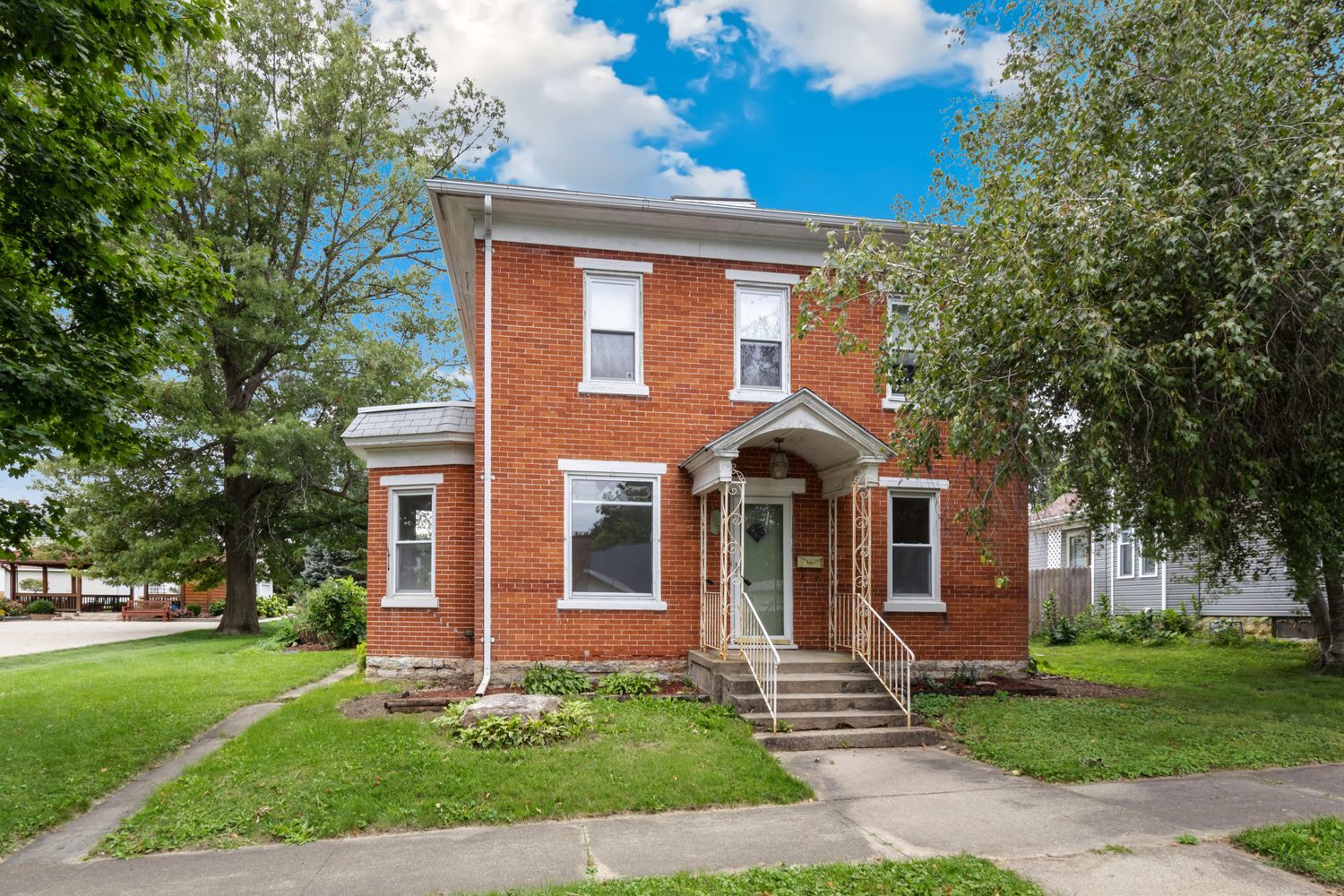 front view of a house with a yard