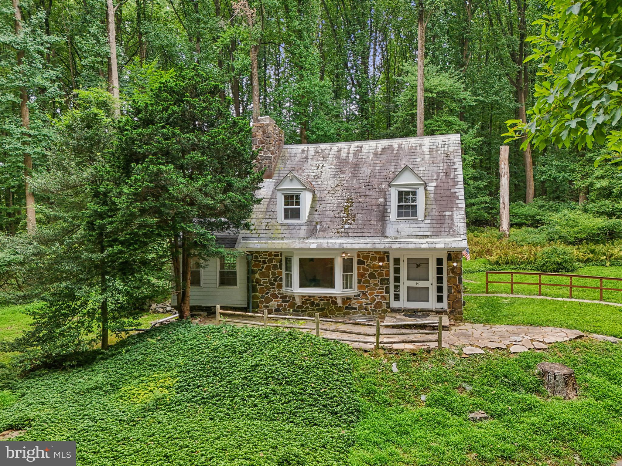 front view of a house with a yard