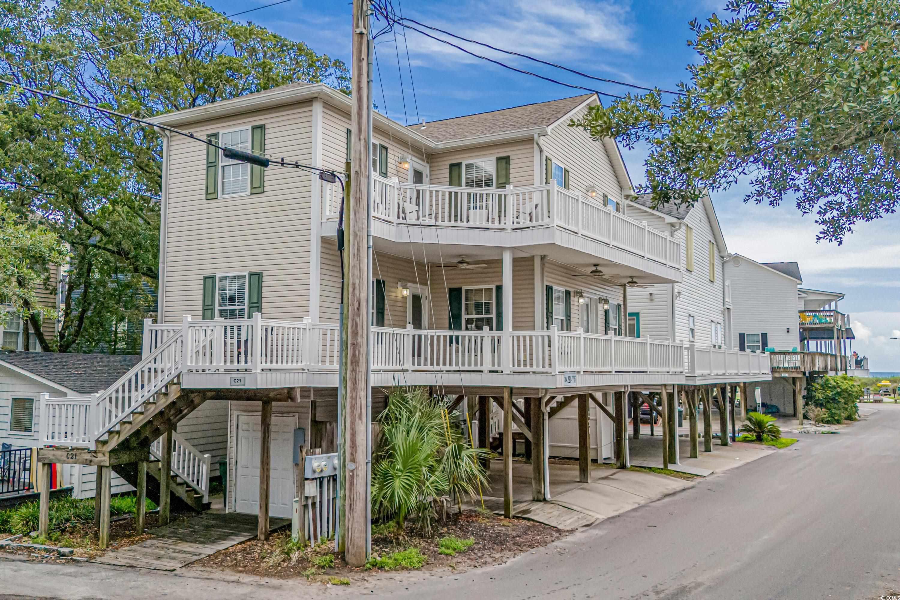 View of front of house with a carport